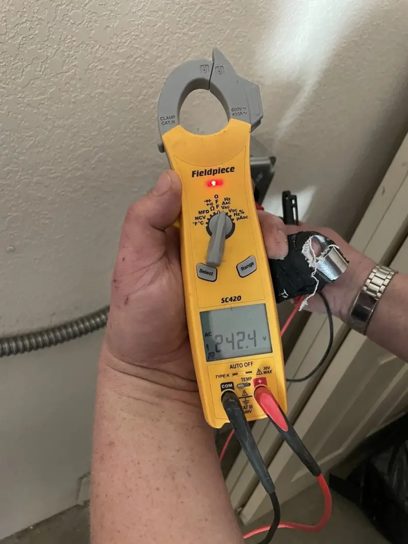 Voltage testing with clamp meter during Outlet Installation in Lake Land'Or